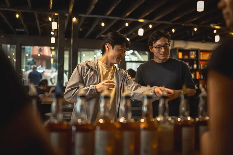 Guests enjoying a whisky club release event