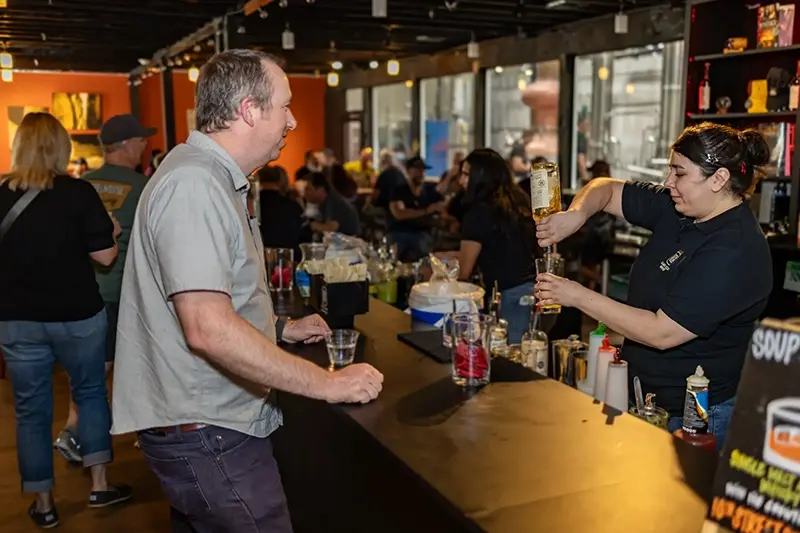 Guests attending a June club event at 10th Street Distillery